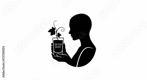 Silhouette of a person holding a glass with a plant growing from a detox drink