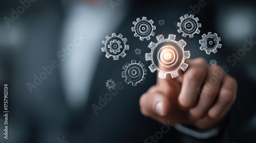 Businessman touching gears representing concept of business process management