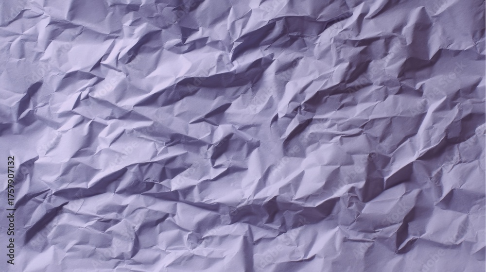 Obraz premium Textured material resembling crumpled paper or fabric in various shades of purple with different levels of light reflect