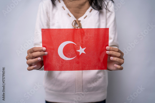 Person Holding the Flag of Turkey with Pride