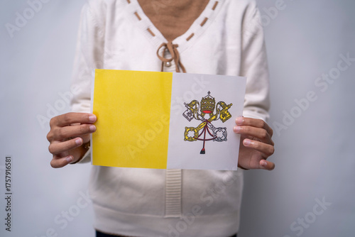 Person Holding the Flag of Vatican City with Pride