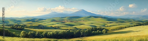 Expansive rolling green hills with scattered trees under a bright sky and distant blue mountains creating a peaceful and serene rural landscape