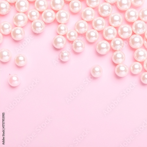 A cluster of lustrous white pearls elegantly scattered on a soft pink background, creating a delicate and sophisticated visual contrast.