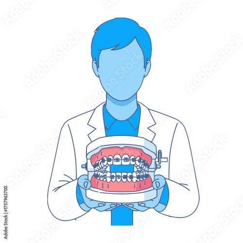 Dentist holding dental model with braces