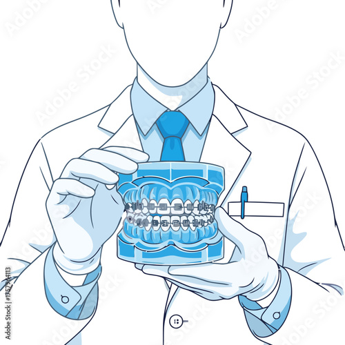 Dentist holding dental model teeth with braces, showing orthodontic treatment