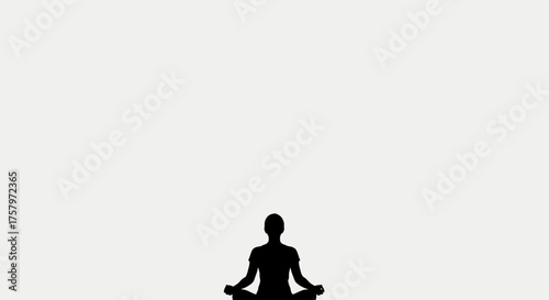 Silhouette of person meditating in lotus position conveys peace and serenity