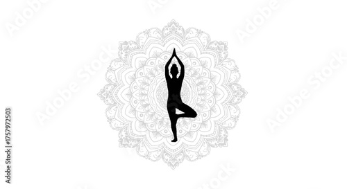 Silhouette of a woman in tree pose practicing yoga with mandala background for wellness and