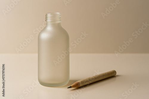 Recycled frosted glass bottle mockup for eco liquid product on elegant white studio background