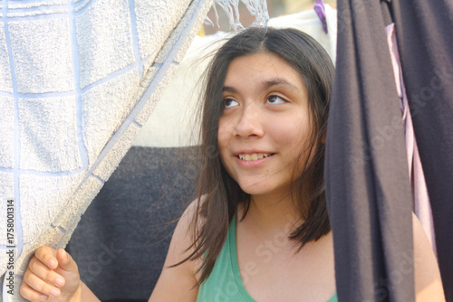 Happy teenager girl smiling joyfully.