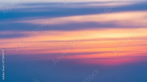 Abstract gradient of blended orange, pink, and blue hues, softly diffused