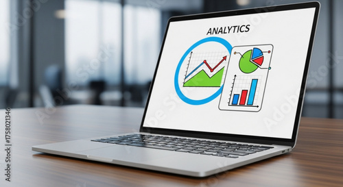 Laptop displaying analytics data on screen in a modern office setting