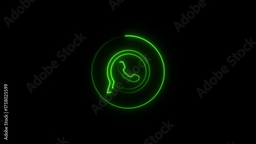Green neon outline of Whats App logo with a speech bubble and phone icon on a black background whatsapp