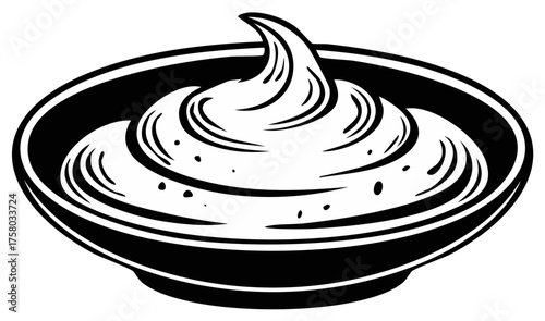 Swirl of whipped cream or frosting in a black bowl on a white background with speckles