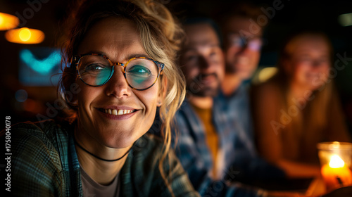 Confident businesswoman smiling with her team in a modern workspace, representing positivity, teamwork, and innovation.