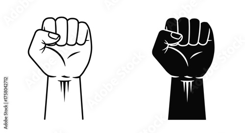 Two contrasting clenched fists one light and one dark silhouette