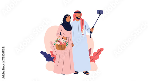 A smiling couple in traditional attire captures a selfie with a selfie stick in a beautiful outdoor setting with floral accents.