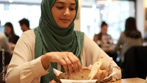 Young Woman in Hijab Sitting at Restaurant Table