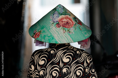 Vietnamese woman wearing the traditional conical hat. Portrait. Vung Tau. Vietnam.
