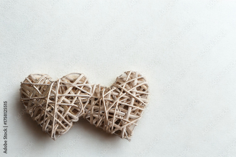 Fototapeta premium Two rustic woven heart shapes connected together