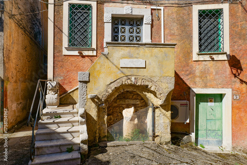 Facade of an old house in Padula, a village in the province of Salerno, Italy.