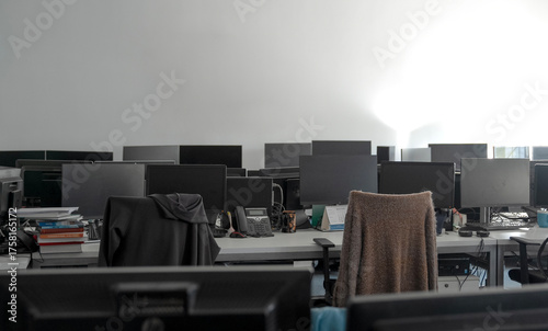 an empty office openspace room, no employees, daylight