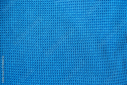 Blue knitted fabric texture with waffle pattern