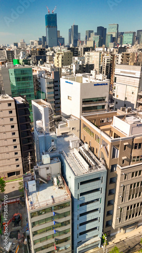 Photography Breathtaking drone shot over Tokyo showing dense skyline, streets, and iconic bu