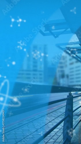 Animation of molecules over train station and cityscape