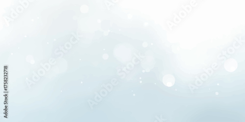 Abstract blue Christmas background with glowing bokeh and bright winter snow pattern