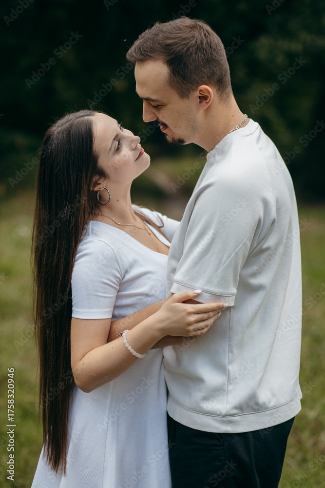Obraz premium Young couple walking at nature at summer 