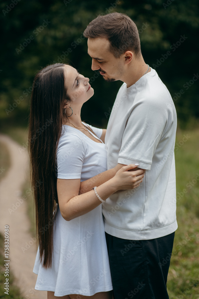 Obraz premium Young couple walking at nature at summer 