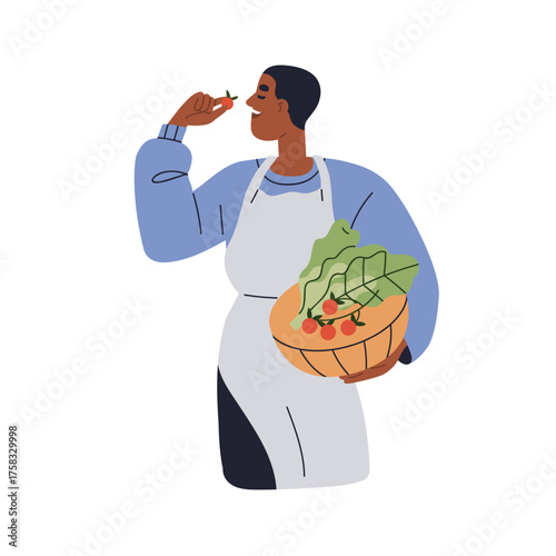 Man with fresh farm vegetables. Farmer holding natural organic cherry tomatoe...
