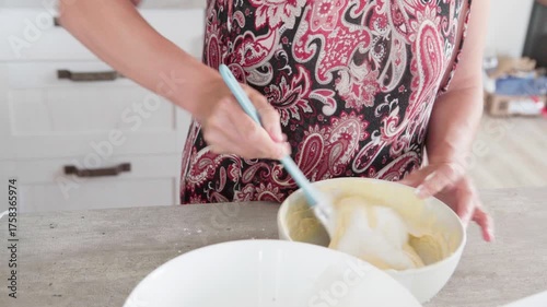 4K close-up video of dought being whisked in deep white bowl while making apple cake, homemade baking process, fresh ingredients, healthy food, nutritious dessert, cooking at home, nutrition concept