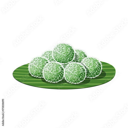 A Pile of Green Coconut Balls Covered in Shredded Coconut on a Banana Leaf.