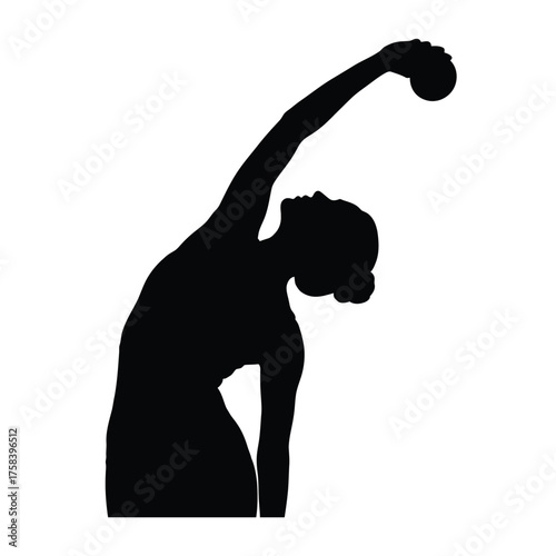 Silhouette of a woman in a rhythmic gymnastics pose with a ball raised above her head in monochrome