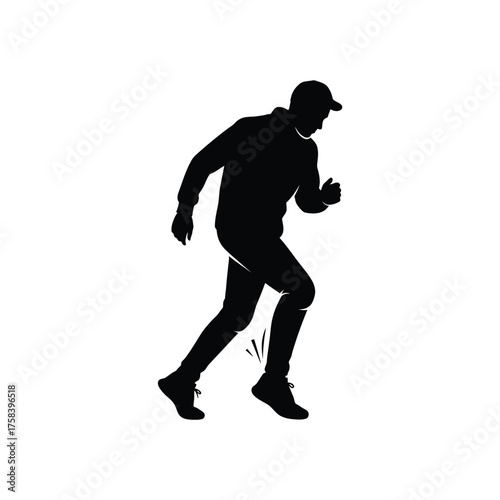 A silhouette of a person wearing a cap and jacket running with their knee raised high up