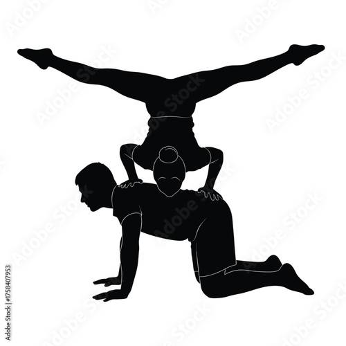 Silhouette of acrobatic couple performing a balancing act with legs split in the air pose