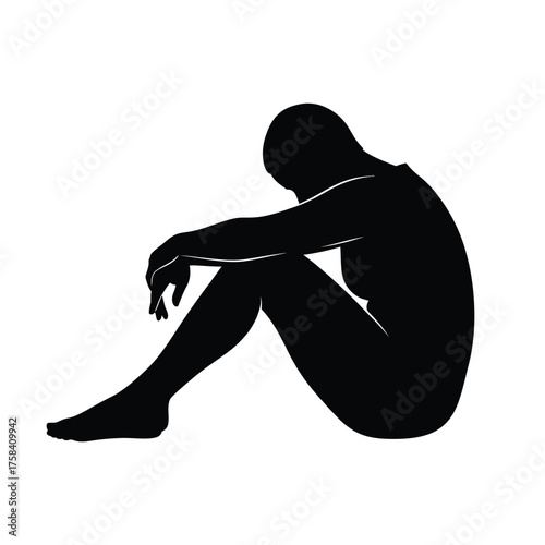 Silhouette of a person sitting with their head down and arms resting on their knees in black