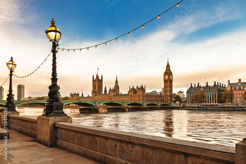Photography Palace of Westminster and Big Ben viewed from the South Bank with historic lamps