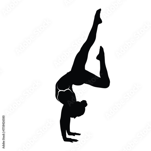 Silhouette of gymnast performing handstand with one leg bent and one leg extended upward