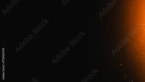 Photography Dark abstract background with warm orange light and glowing dust particles, atmospheric film grain texture