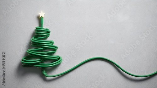Creative Christmas tree made from green electric cable with star shining brightly, perfect for modern holiday greetings and eco-friendly marketing campaigns
