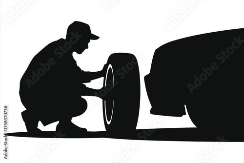 Silhouette of an auto mechanic changing a tire. Car repair and vehicle maintenance service concept. Isolated on a white background.