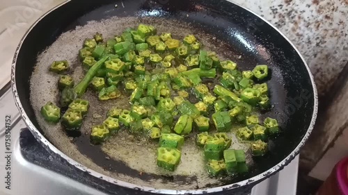 Lady finger fry, also known as bhindi fry or okra fry, is a popular side dish in Indian cuisine featuring stir fried okra.