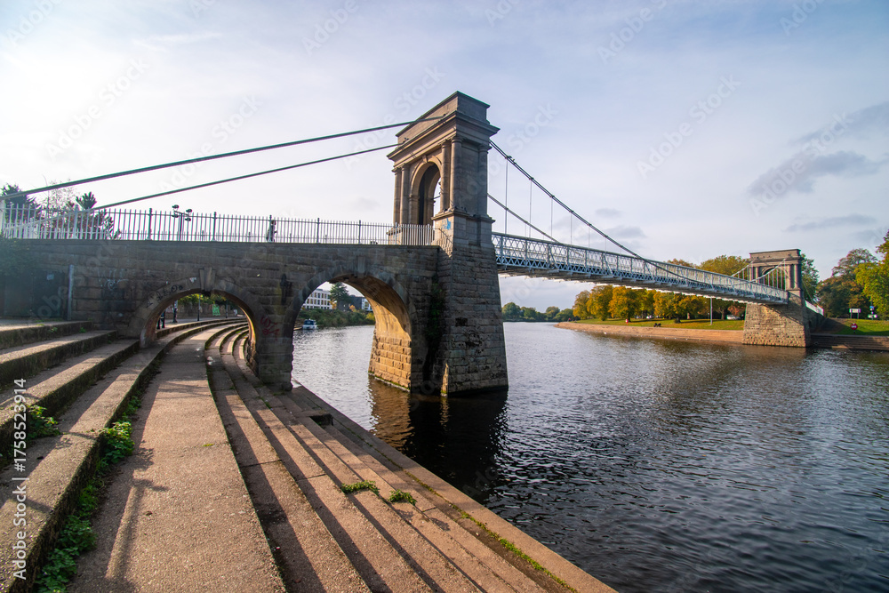 Fototapeta premium A view of Wilford Suspension bridge over the river Trent in Nottingham from the Victoria Embankment.