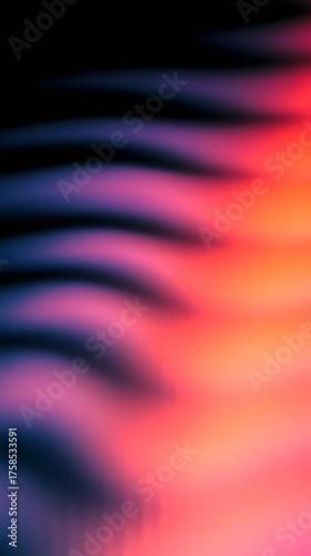 Abstract wavy lines of purple and pink gradient blend into orange and black.