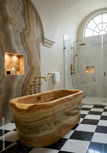 Luxurious Marble Bathtub Bathroom with Gold Fixtures and Large Arched Window