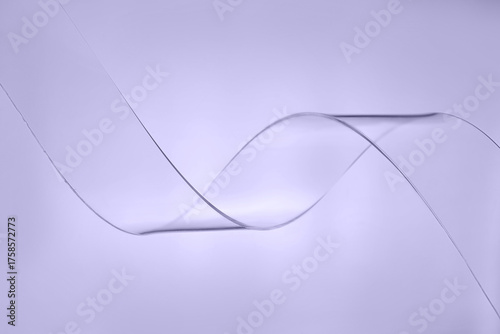 Transparent plastic wave on purple background