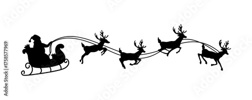 silhouette of santa claus riding sleigh with flying reindeer