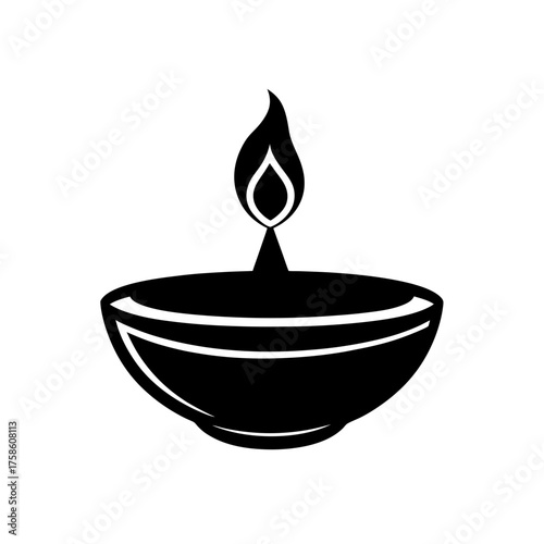 Black diya lamp with flame on top on transparent background silhouette